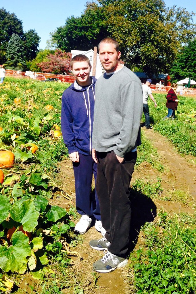 Scott Kologi and Steven Kologi at a pumpkin patch.