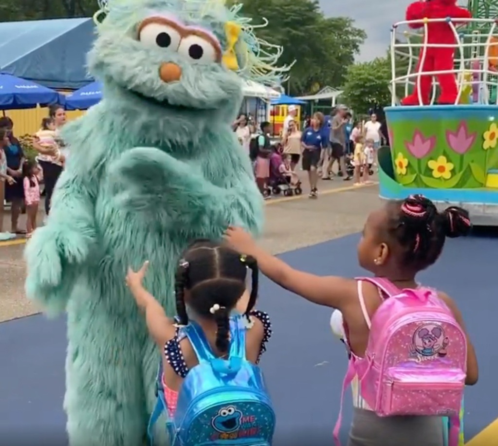 The character high-fived other children watching the parade.