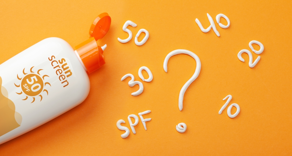 Sunscreen is squeezed out of its tube into a question mark shape.