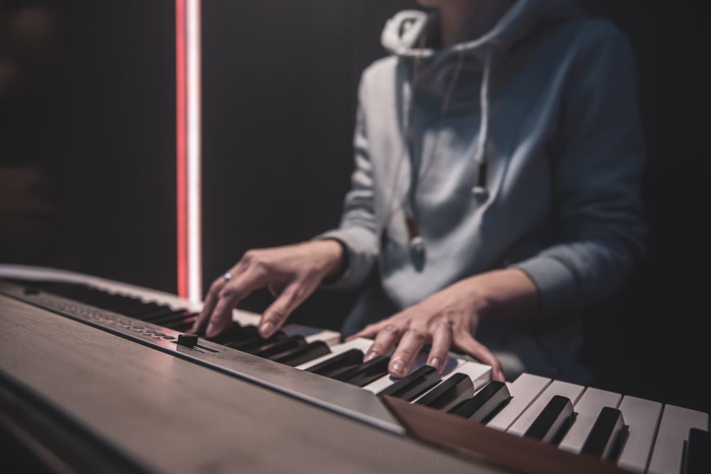 A man plays the piano.