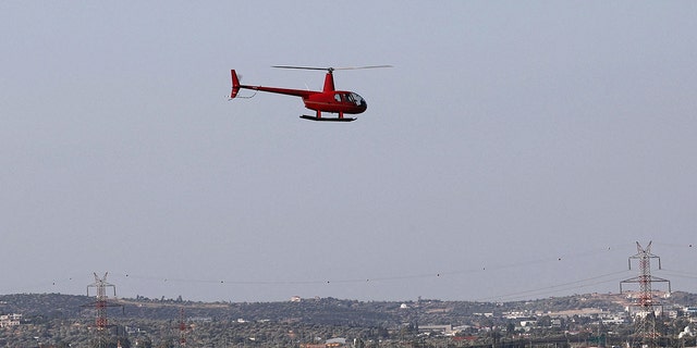 A helicopter takes off from Superior Air Helipad in Spata, near Athens, where a man died when helicopter propeller hit him after landing. 