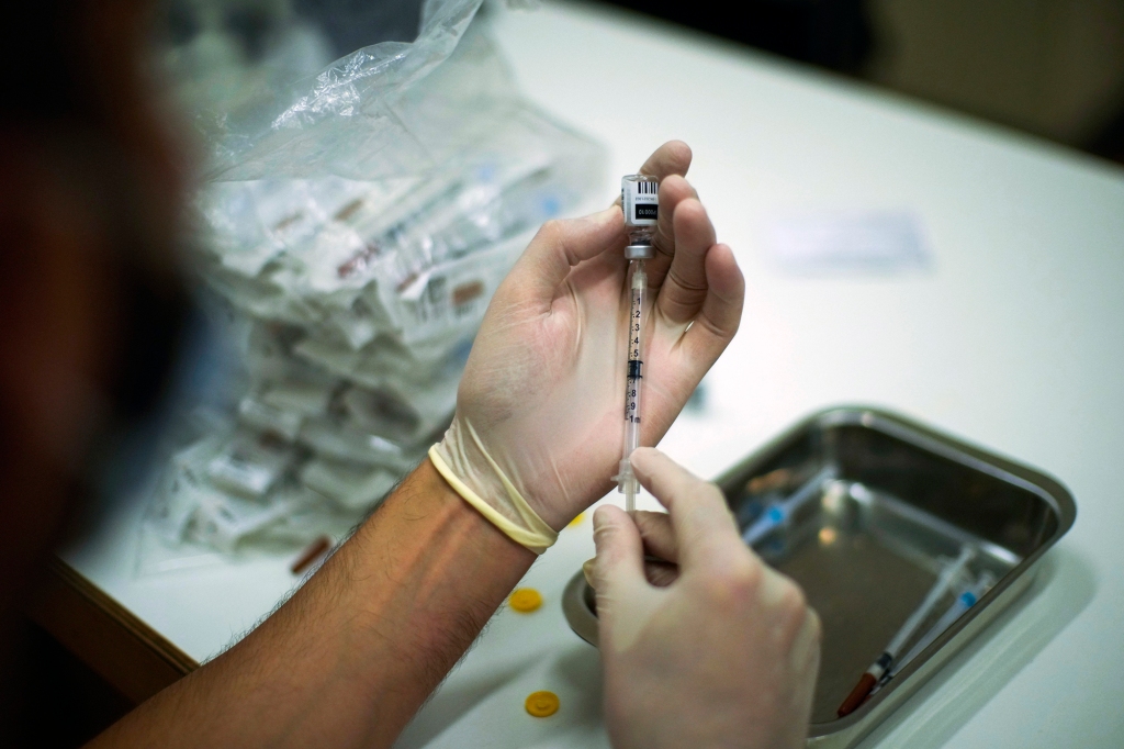 A health professional prepares syringes with vaccines against Monkeypox.