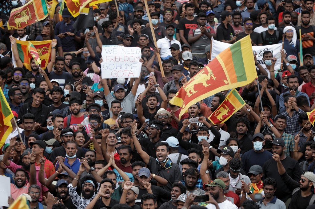 Demonstrators celebrate after storming through the presidential palace of Sri Lanka president Gotabaya Rajapaksa in Colombo, Sri Lanka on July 9, 2022.