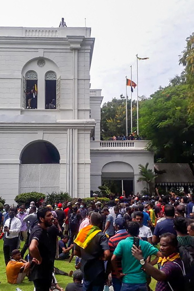 Protestors are spotted outside Sri Lanka's Presidential Palace in Colombo on July 9, 2022. 