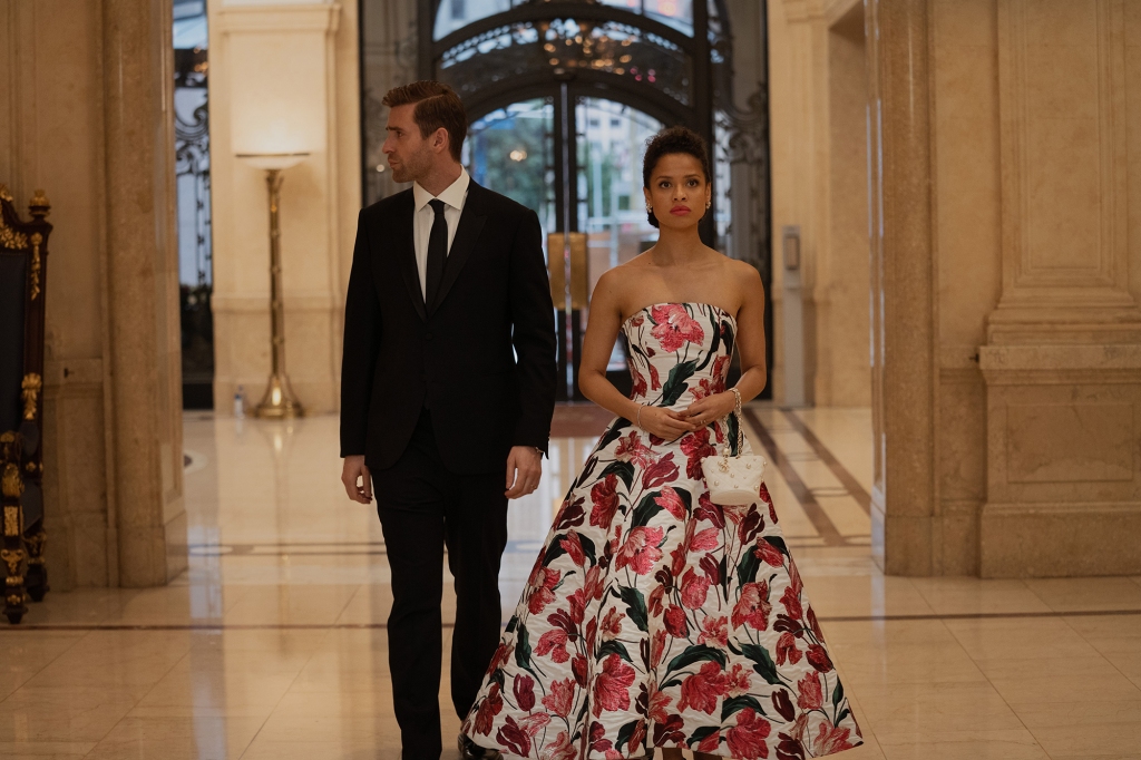 Gugu Mbatha-Raw and Oliver Jackson-Cohen in “Surface,” dressed to the nines in a nice building. 