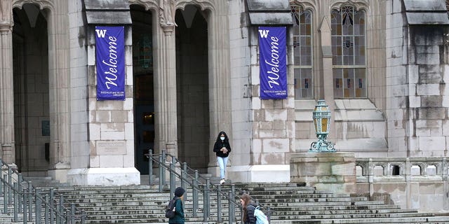 Students at the University of Washington are on campus for the last day of in-person classes on March 6, 2020, in Seattle, Washington.