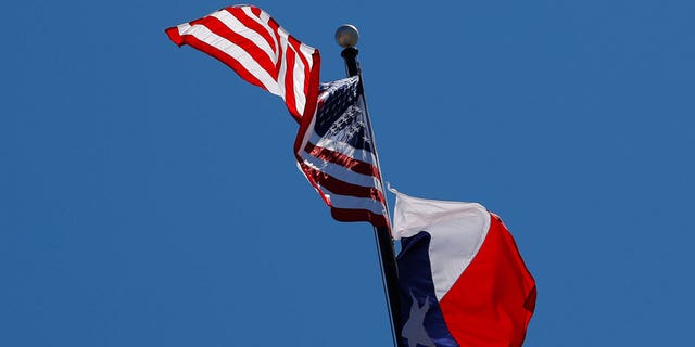 The U.S flag and the Texas State flag fly over the Texas State Capitol as the state senate debates the #SB6 bathroom bill in Austin, Texas, U.S., March 14, 2017. 