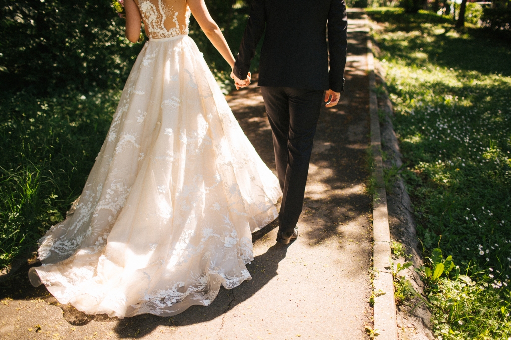 Bride and groom walking on pavements