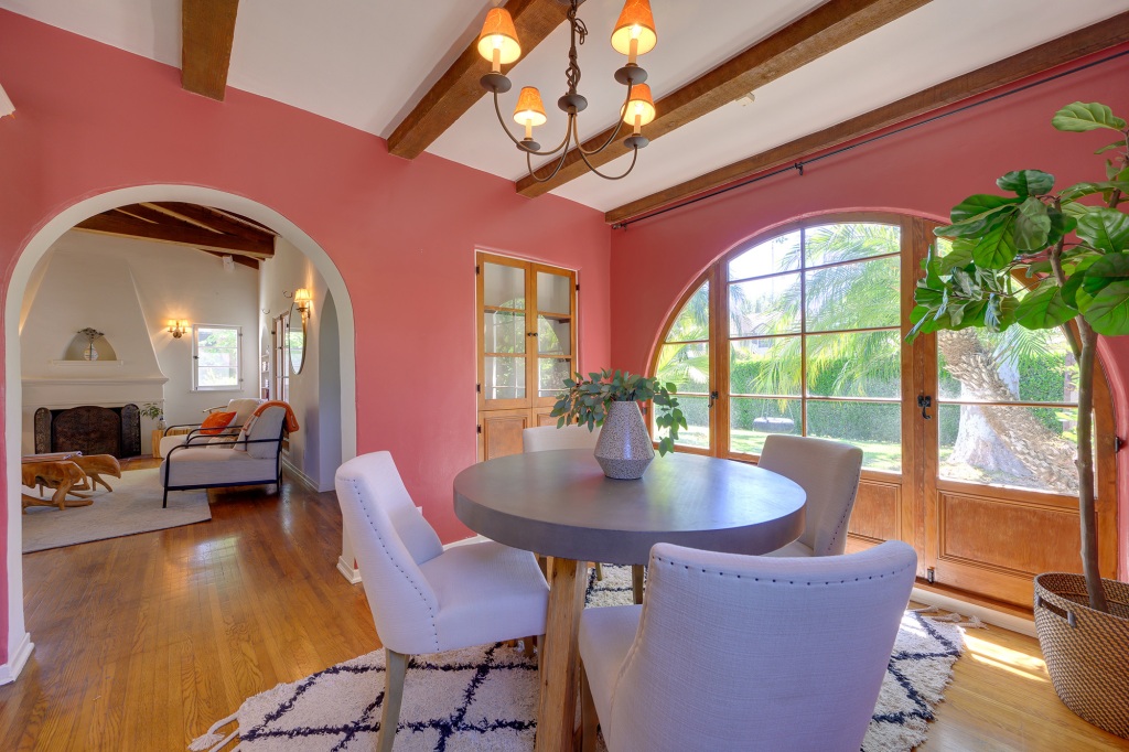 The formal dining room has an arched doorway leading into it, as well as an arched window.