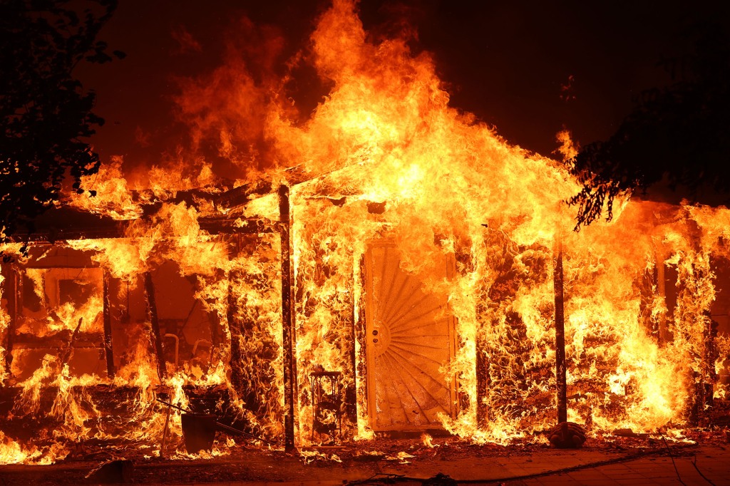 A home burning in the Oak Fire near Mariposa, California on July 23, 2022.