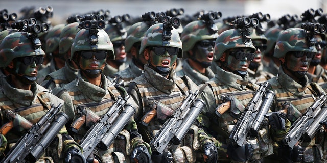 North Korean soldiers march and shout slogans during a military parade marking the 105th birth anniversary of the country's founding father, Kim Il-sung, in Pyongyang, North Korea, on April 15, 2017.