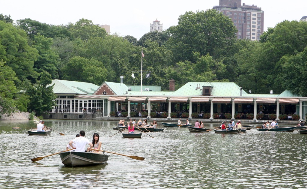 People on Boats at the Boathouse celebrating the 4th of July weekend in Central Park, Manhattan, NY.