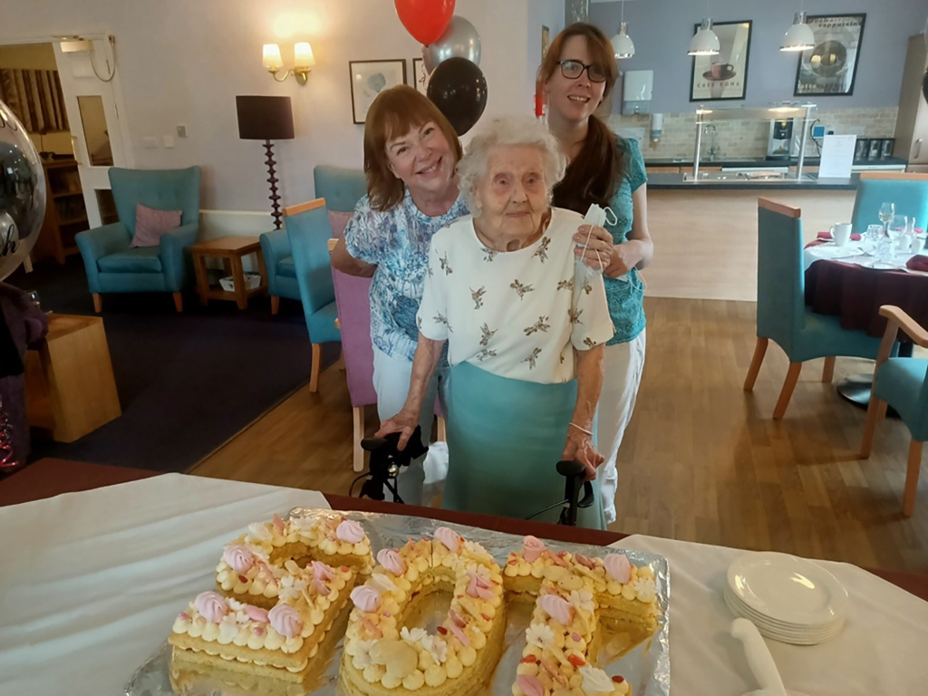 Norah at her 105th birthday with Gill 