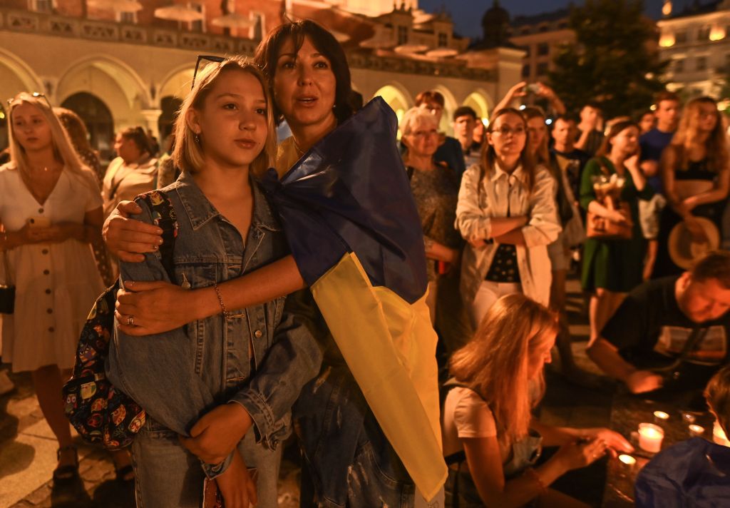 Supporters are seen during a candlelight vigil 'Light A Candle For Ukraine' on the eve of Ukraine's Independence Day in Krakow Market Square on Aug. 23, 2022.