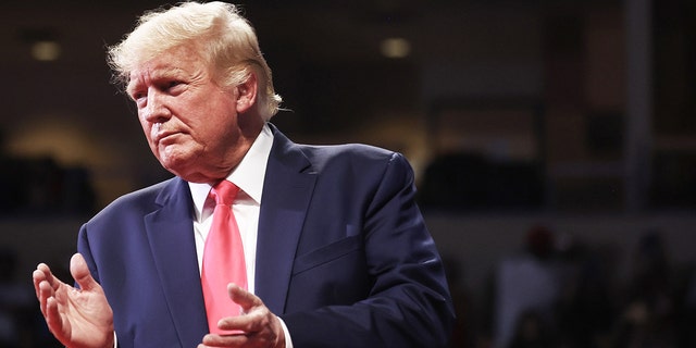 Former President Donald Trump applauds at a rally in support of Arizona GOP candidates he endorsed in the state's primary. The rally took place on July 22, 2022 in Prescott Valley, Arizona.