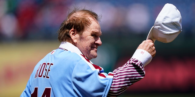 Former Philadelphia Phillies player Pete Rose tips his hat to fans during an alumni day event before a game between the Philadelphia Phillies and the Washington Nationals, Aug. 7, 2022, in Philadelphia.