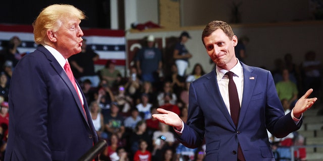 Former President Donald Trump stands with Republican Senate candidate Blake Masters at a "Save America" rally on July 22, 2022, in Prescott Valley, Arizona.