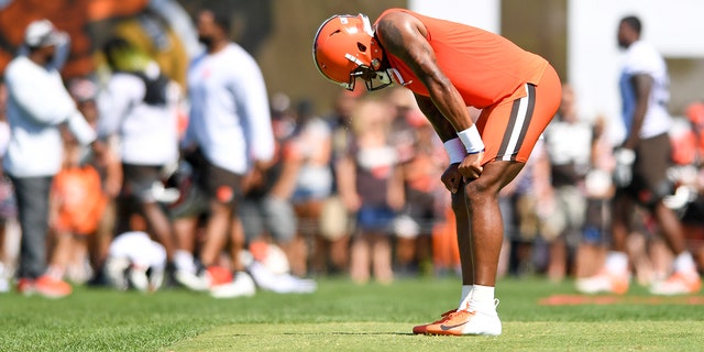 Deshaun Watson, #4 of the Cleveland Browns, rests after running a drill during Cleveland Browns training camp at CrossCountry Mortgage Campus on July 30, 2022 in Berea, Ohio.