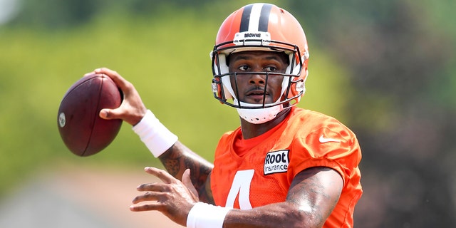 Cleveland Browns quarterback Deshaun Watson prepares to throw a pass during training camp Aug. 1, 2022, in Berea, Ohio.