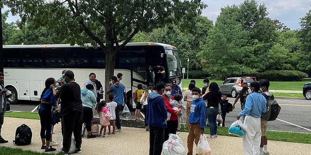 Approximately 30 migrants disembark after arriving by bus from Texas at Union Station in Washington, D.C., July 29, 2022.