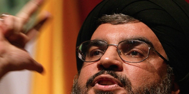 Sheikh Hassan Nasrallah, head of the Lebanese Shiite Muslim movement Hezbollah, delivers a speech to mark the anniversary of assassination by Israel of its secretary general Sheikh Abbas Musawi, Feb. 16, 2006, in Beirut. 