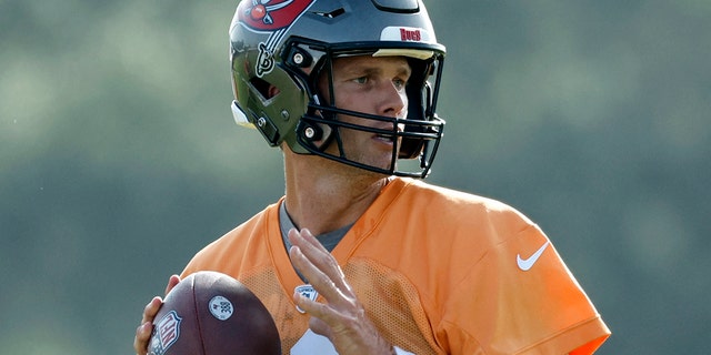 Tampa Bay Buccaneers quarterback Tom Brady works out during training camp at AdventHealth Training Center in Tampa, Florida, on July 28, 2022.