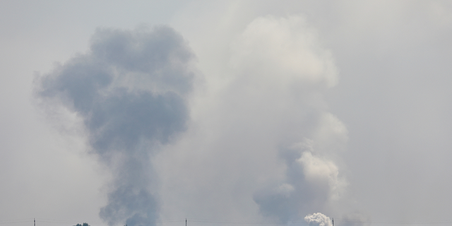 A view shows smoke rising above the area following a reported explosion in the village of Mayskoye in the Dzhankoi district of Crimea on Aug. 16, 2022.