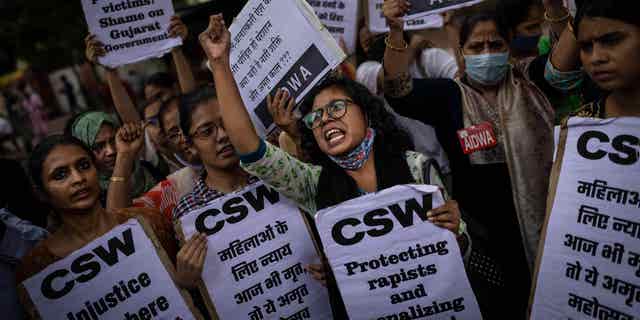 Activists protest the remission of sentences for 11 convicts of a gang rape, in New Delhi, India, on Thursday, Aug. 18, 2022.