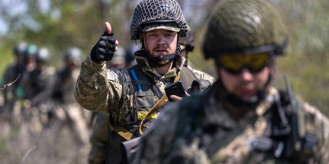 Dnipropetrovsk Oblast, UKRAINE - MAY 09: Ukrainian infantrymen train on May 09, 2022 near Dnipropetrovsk Oblast, Ukraine. Infantry soldiers learned scenarios to survive when potentially confronted with a Russian tank closing in at close range. 