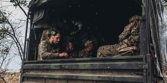 DONBASS, UKRAINE - JUL 23: Ukrainian soldiers in a truck on the Donbass frontline Donetsk, (Ukraine), 23 July 2022.