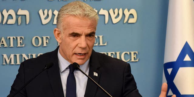 Israeli Prime Minister Yair Lapid speaks at a security briefing about Iran for the foreign press at the Prime Minister's office in Jerusalem on August 24, 2022. 