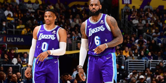 Russell Westbrook, left, and LeBron James of the Los Angeles Lakers take on the New Orleans Pelicans in an NBA game at Crypto.Com Arena in Los Angeles on April 1, 2022.