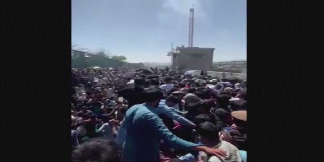 Crowds are seen Thursday outside of Kabul airport prior to the deadly suicide bombing.