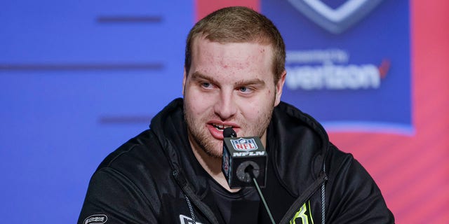 Trevor Penning #OL38 of the Northern Iowa Panthers speaks to reporters during the NFL Draft Combine at the Indiana Convention Center on March 3, 2022, in Indianapolis, Indiana.