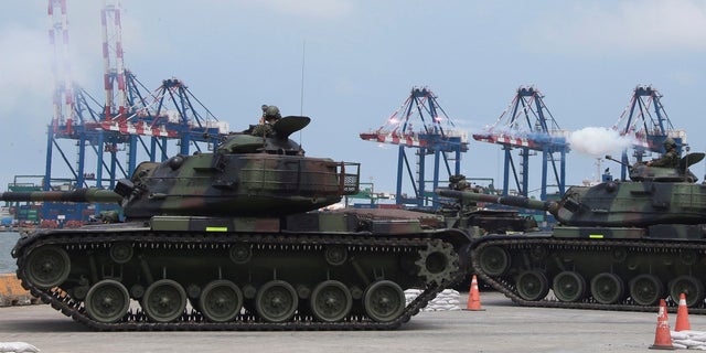 FILE - Taiwan military forces conduct anti-landing drills during the annual Han Kuang military exercises near New Taipei City, Taiwan, on July 27, 2022.