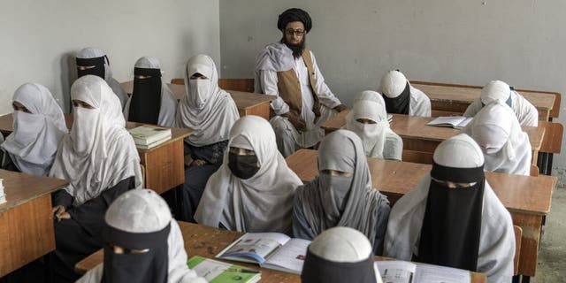 Afghan girls attend a religious school, which remained open since the last year's Taliban takeover, in Kabul, Afghanistan, Thursday, Aug 11, 2022. 