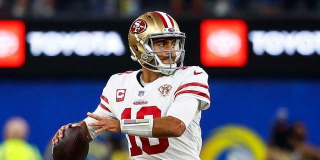 Jimmy Garoppolo of the San Francisco 49ers looks to pass in the NFC championship game against the Los Angeles Rams at SoFi Stadium Jan. 30, 2022, in Inglewood, Calif.