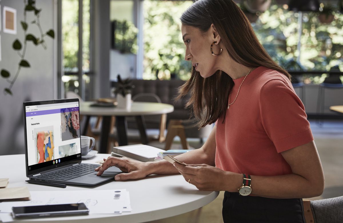 A worker uses the HP Elite Dragonfly Chromebook in a cafe setting.