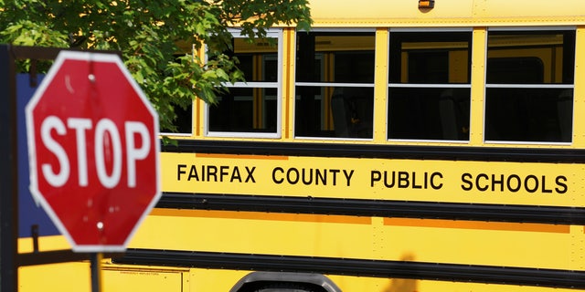 A Fairfax County school bus sits in a depot, a day after it was announced the county would begin the school year all online, in Lorton, Virginia, U.S., July 22, 2020. 