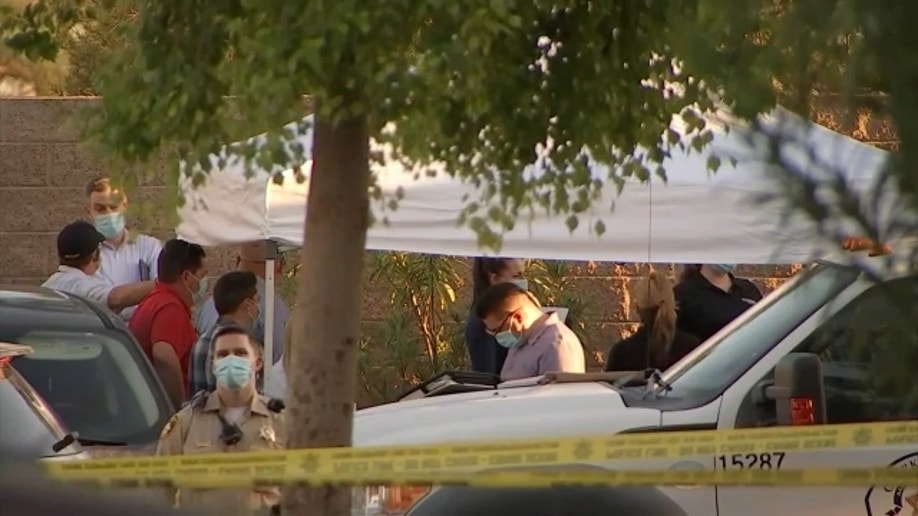 A white tent is set up as police investigate after a body was found in Las Vegas