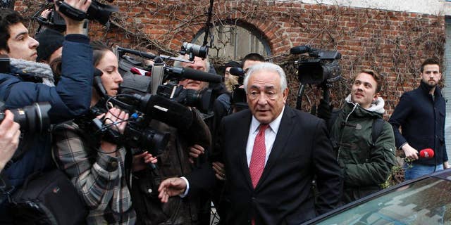 Feb. 12, 2015: Former International Monetary Fund boss Dominique Strauss-Kahn leaves his hotel in Lille, northern France, as he goes on trial for sex charges at a court. 