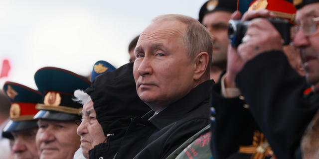 Russian President Vladimir Putin looks on during the Victory Day military parade marking the 77th anniversary of the end of World War II in Moscow, Russia, on Monday, May 9.