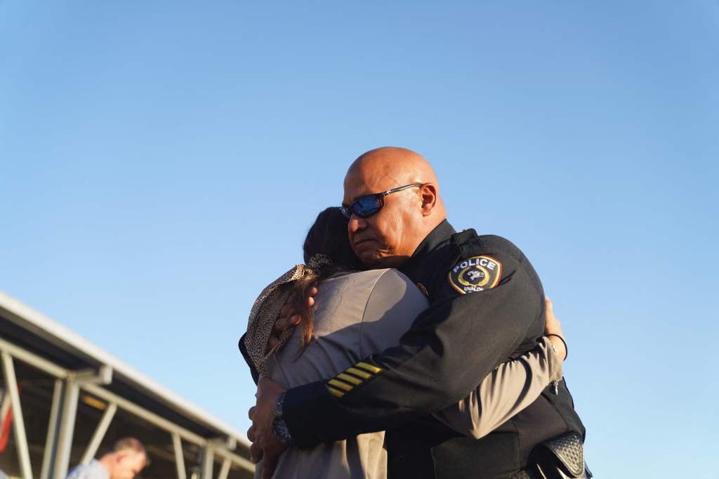 Uvalde Police chief Pete Arredondo comforts a woman during a vigil for the victims of the mass shooting at Robb Elementary School.