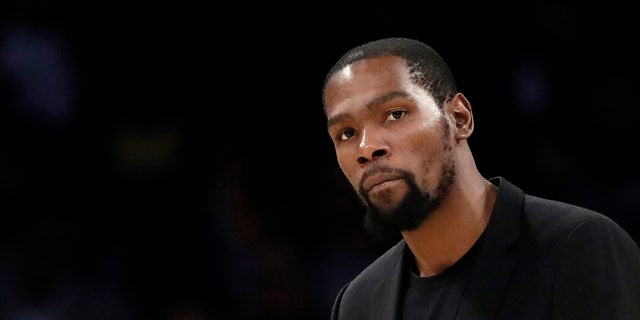 The Brooklyn Nets' Kevin Durant watches during the second half of the team's game against the Los Angeles Lakers in Los Angeles.