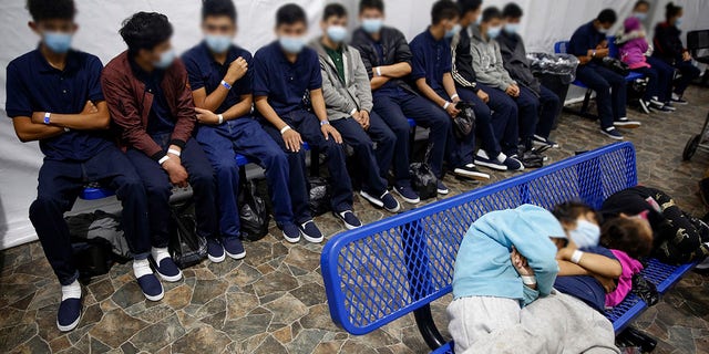 Young unaccompanied migrants, wait for their turn at the secondary processing station inside the U.S. Customs and Border Protection facility in March 2021. 