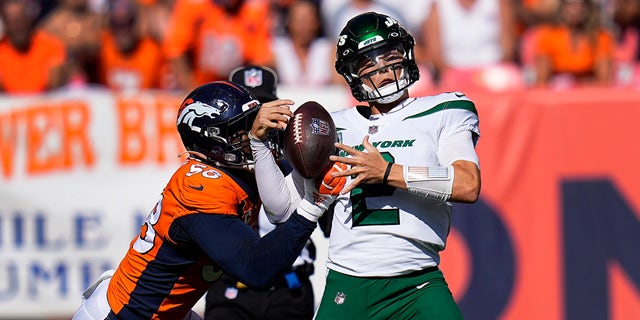 New York Jets quarterback Zach Wilson (2) is sacked by Denver Broncos outside linebacker Von Miller (58) during the first half of a game Sept. 26, 2021, in Denver. 