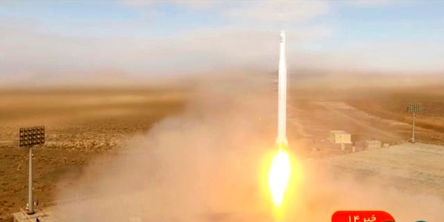 This image taken from video footage aired by Iranian state television on Tuesday, March 8, 2022, shows the launch of a rocket by Iran's Revolutionary Guard carrying a Noor-2 satellite in northeastern Shahroud Desert, Iran.