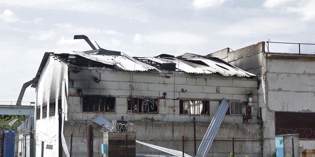 A destroyed barrack at a prison in Olenivka, where dozens of Ukrainian military prisoners who were captured after the fall of a southern port city of Mariupol were killed on July 29, 2022. 