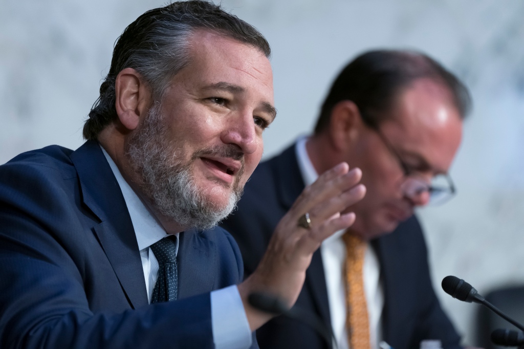 Sen. Ted Cruz, R-Texas, joined at right by Sen. Mike Lee, R-Utah, questions Justice Department officials as the Senate Judiciary Committee examines the threats toward elected leaders and election workers, at the Capitol in Washington, Wednesday, Aug. 3, 2022.