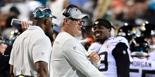 Jacksonville Jaguars coach Doug Pederson, center, watches from the sideline during the first half of the team's NFL football exhibition Hall of Fame Game against the Las Vegas Raiders, Thursday, Aug. 4, 2022, in Canton, Ohio. 